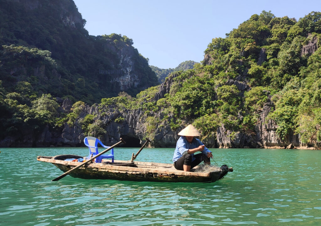 Fisherman in Lan Ha Bay - TricksForTrips