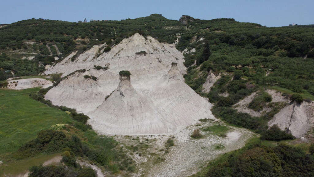 Conic clay mountains in Crete Komolothi - TricksForTrips